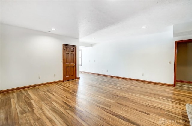 unfurnished room featuring light hardwood / wood-style flooring