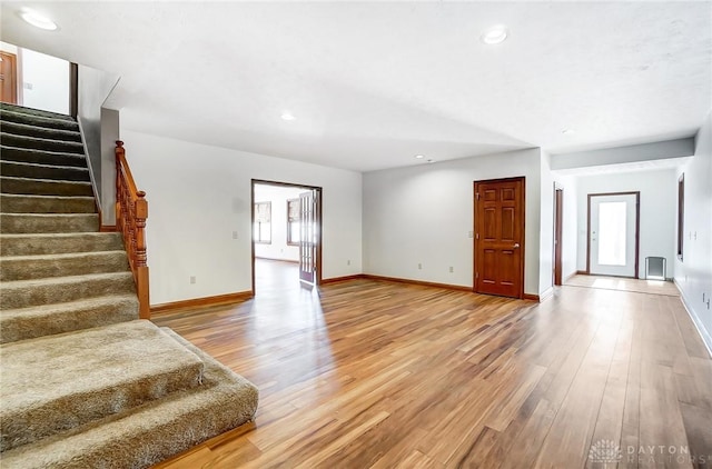 unfurnished living room with hardwood / wood-style floors