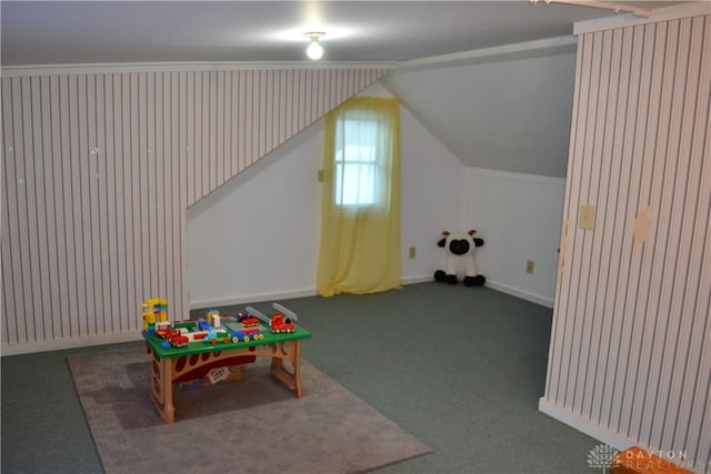 game room with lofted ceiling and dark carpet