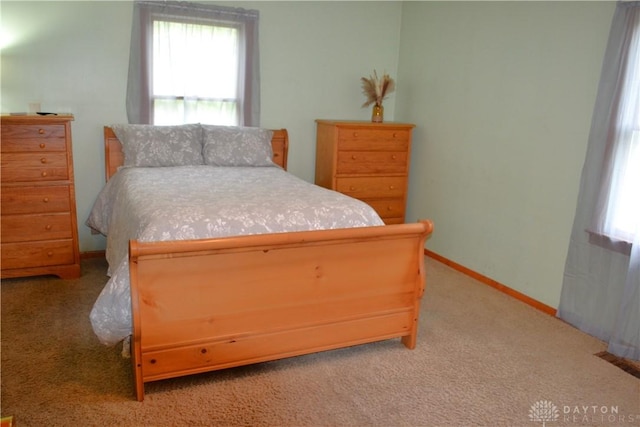 4403 Clayton Rd, Perry Twp, OH 45309 - bedroom featuring light carpet and baseboards