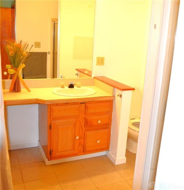 4403 Clayton Rd, Perry Twp, OH 45309 - bathroom with tile patterned flooring, vanity, and toilet