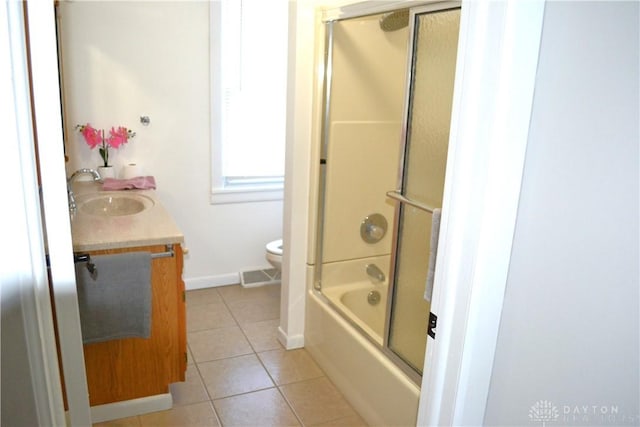 4403 Clayton Rd, Perry Twp, OH 45309 - bathroom featuring tile patterned flooring, toilet, vanity, baseboards, and bath / shower combo with glass door