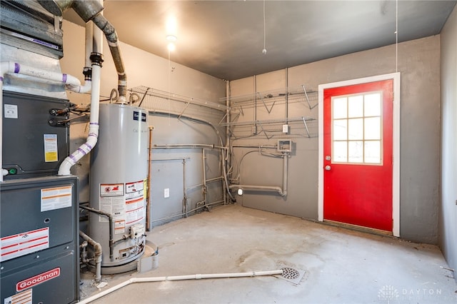 utility room featuring water heater and heating unit