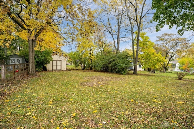 view of yard with an outbuilding and a storage shed