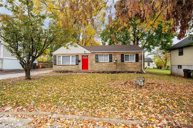 view of front of house featuring a front yard and stone siding