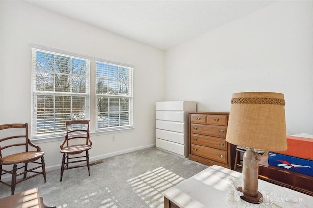 sitting room featuring light carpet