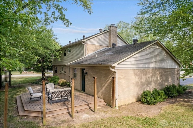 back of house with an outdoor living space and a wooden deck