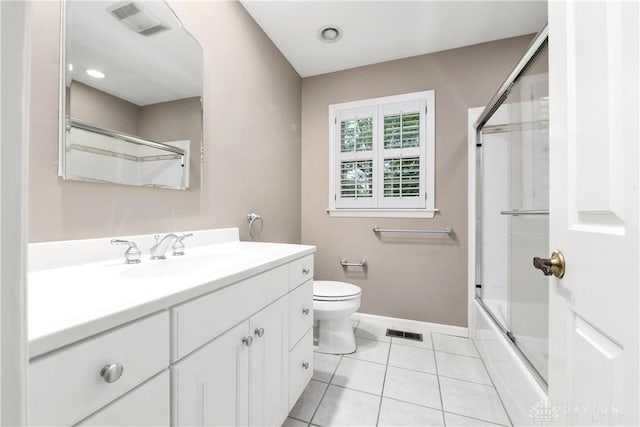 full bathroom with toilet, combined bath / shower with glass door, tile patterned floors, and vanity