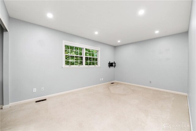 empty room featuring light colored carpet