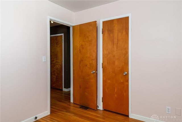 spare room with light hardwood / wood-style floors