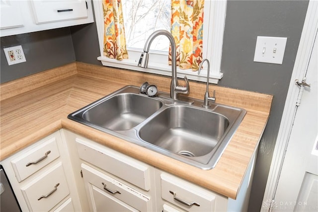 kitchen with white cabinets and sink