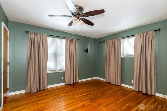 spare room featuring ceiling fan and wood-type flooring