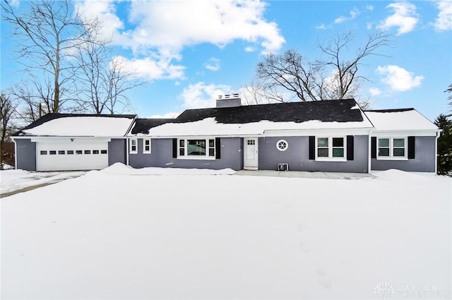 single story home featuring a garage