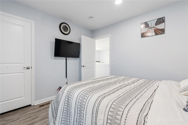 bedroom with light wood-type flooring