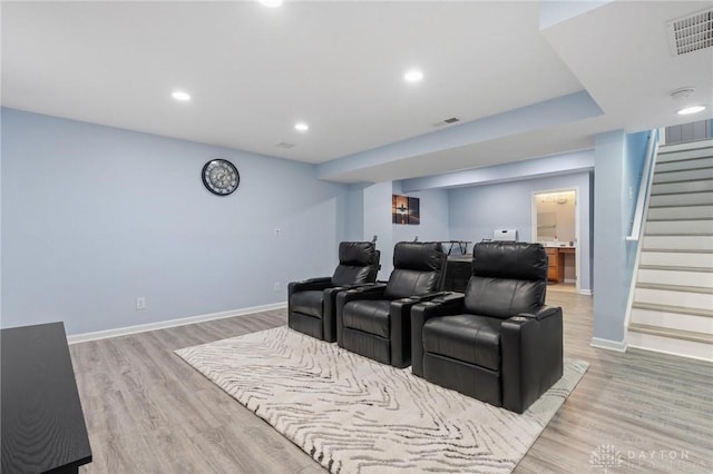 home theater room featuring light wood-type flooring