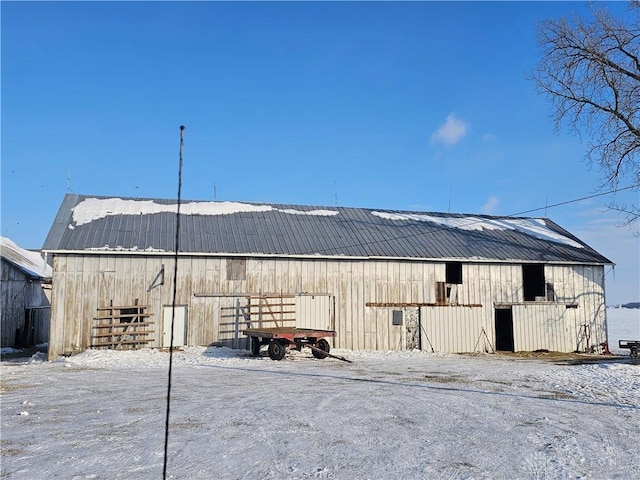 view of yard featuring a garage, an outbuilding, and a barn