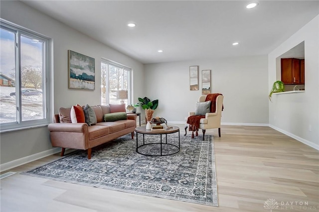 sitting room with light hardwood / wood-style floors and a wealth of natural light