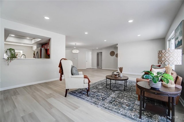 living room with light hardwood / wood-style floors