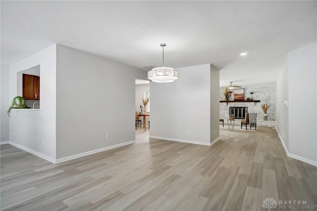 interior space featuring light hardwood / wood-style flooring and a fireplace