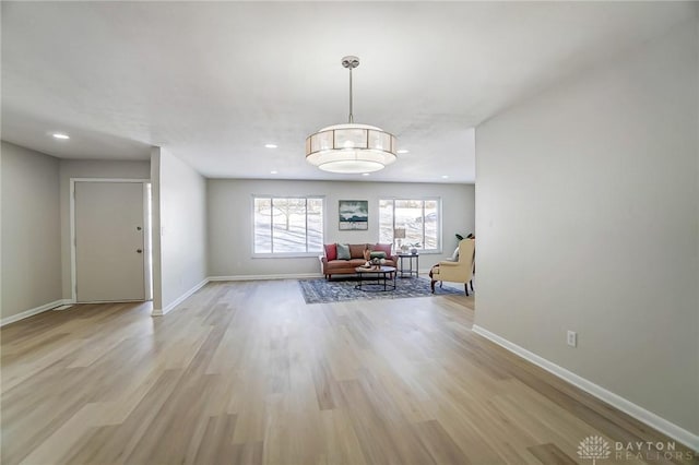 unfurnished dining area featuring light wood-type flooring