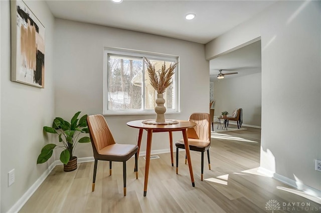 living area featuring ceiling fan and light wood-type flooring