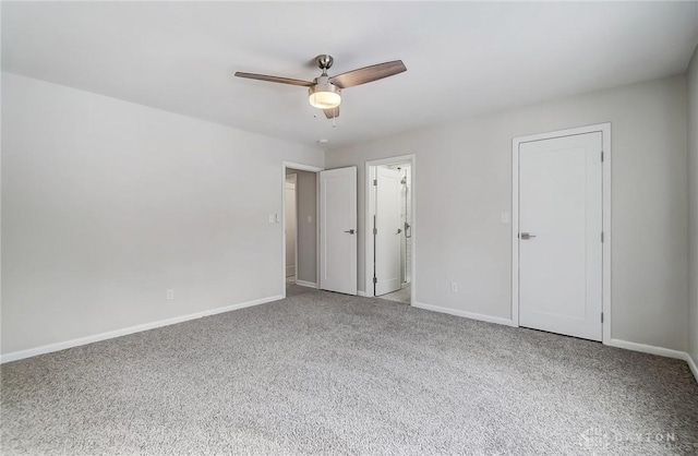 unfurnished bedroom with light colored carpet and ceiling fan