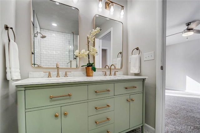 bathroom with ceiling fan, walk in shower, and vanity