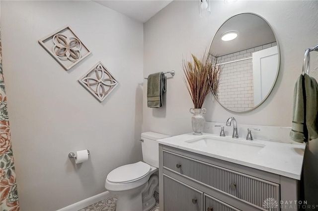 bathroom with toilet and vanity