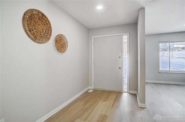 entryway with light hardwood / wood-style flooring