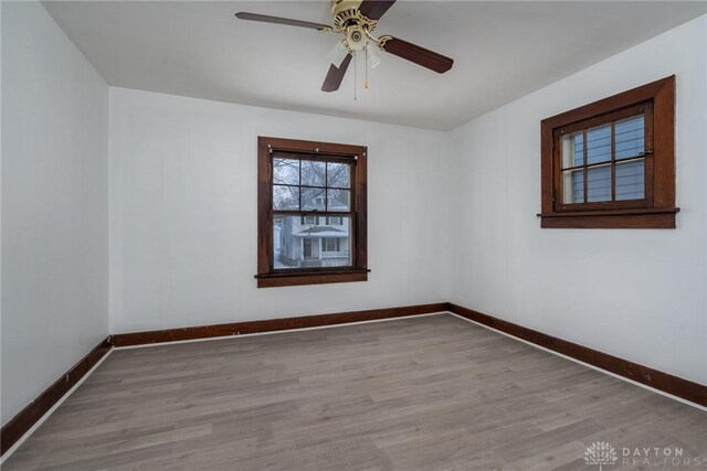 unfurnished room featuring ceiling fan and light hardwood / wood-style floors