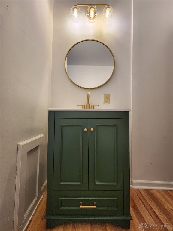 bathroom with vanity and wood-type flooring