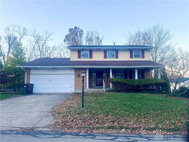 front facade featuring a porch, a garage, and a front yard