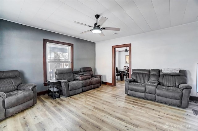 living room with ceiling fan and light wood-type flooring