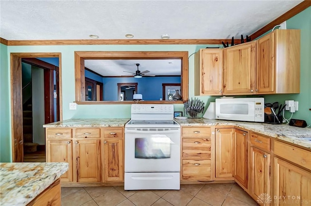 kitchen featuring white appliances, ceiling fan, light stone countertops, and light tile patterned floors