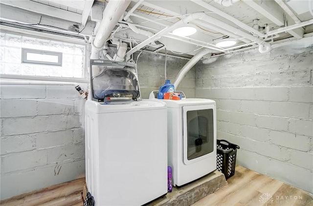 laundry area with independent washer and dryer