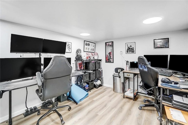 office space with light wood-type flooring