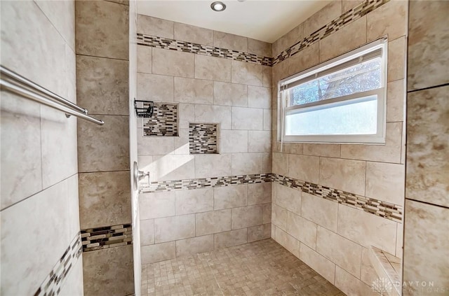 bathroom featuring a tile shower