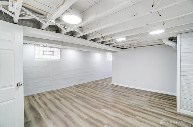 basement featuring wood-type flooring