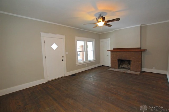 unfurnished living room featuring baseboards, dark wood-style flooring, and crown molding