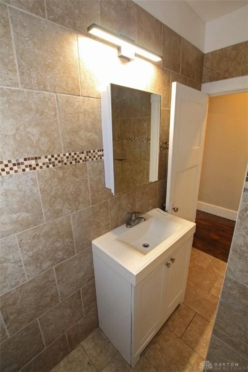 bathroom with tile patterned flooring and vanity