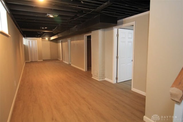 finished basement with wood finished floors and baseboards