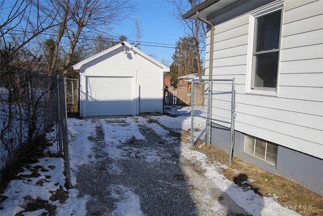 exterior space featuring fence and a detached garage