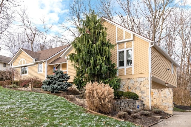 view of home's exterior featuring a yard