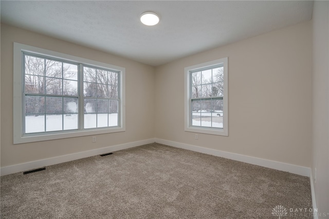 empty room with carpet flooring