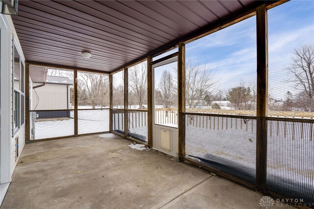 unfurnished sunroom with a healthy amount of sunlight