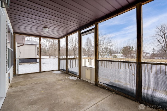 unfurnished sunroom with plenty of natural light