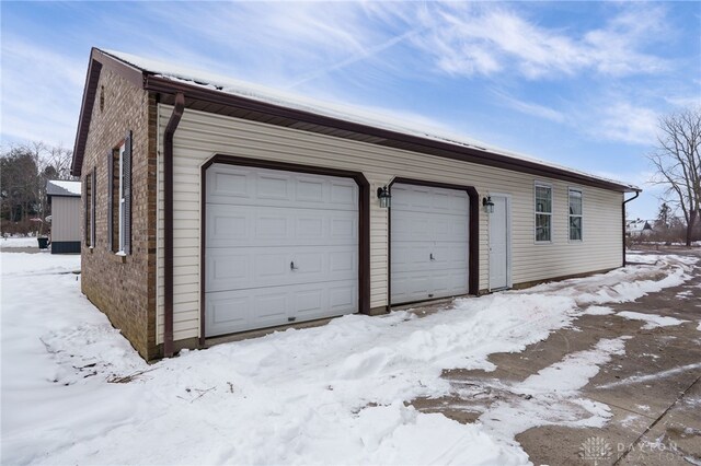 view of snow covered garage