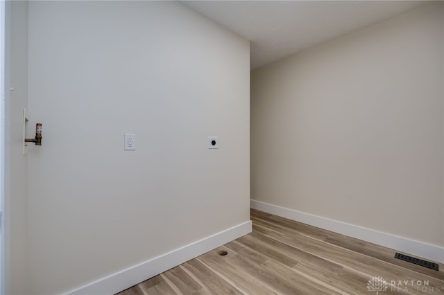 spare room with light hardwood / wood-style floors