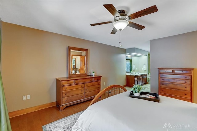 bedroom featuring ensuite bathroom, ceiling fan, and light hardwood / wood-style flooring