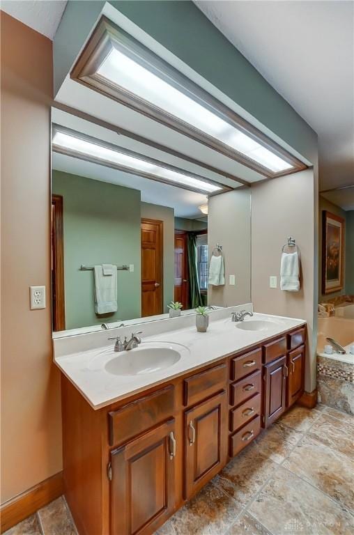 bathroom featuring vanity and a bath